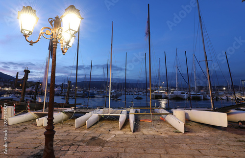 Fototapeta Naklejka Na Ścianę i Meble -  Catamaran boats in old port of Ajaccio, the capital of Corsica island, France. Night photo