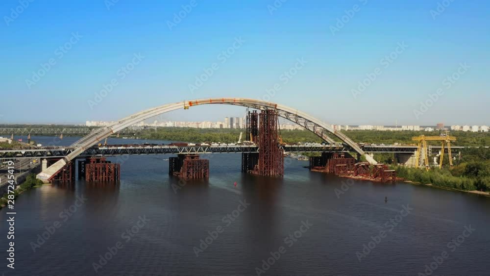 Arch bridge under construction over the river Dnepr