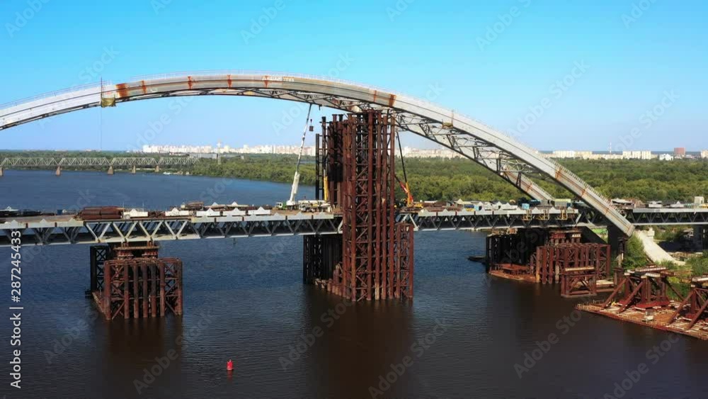 Arch bridge under construction over the river Dnepr
