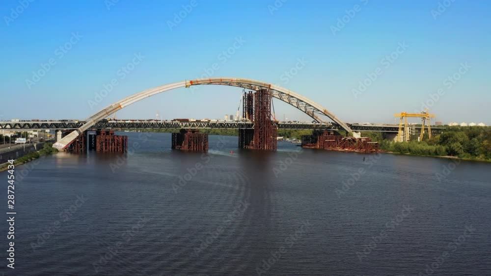 Arch bridge under construction over the river Dnepr Arch bridge under construction over the river Dnepr