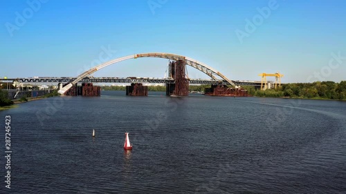 Arch bridge under construction over the river Dnepr photo