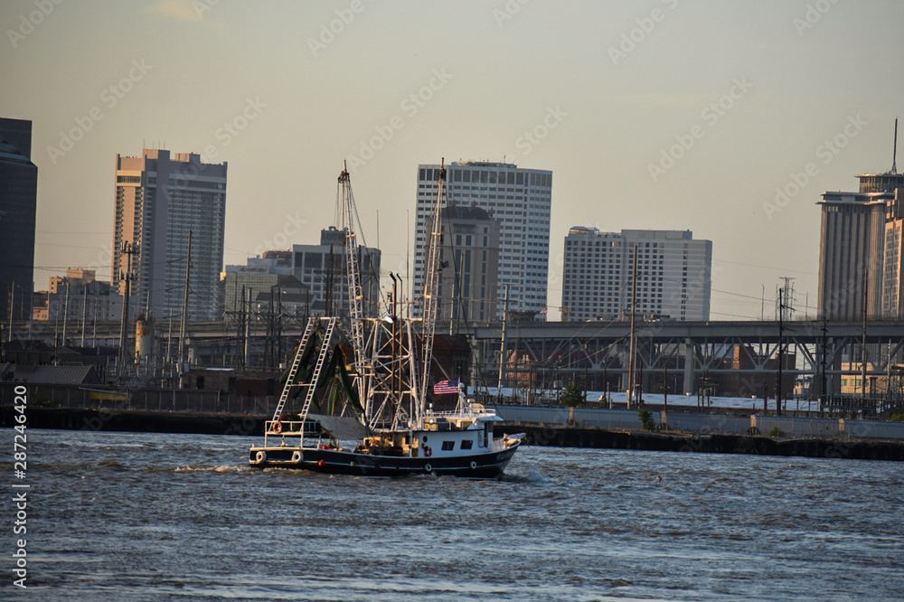 Fototapeta premium new orleans skyline with trawlboat