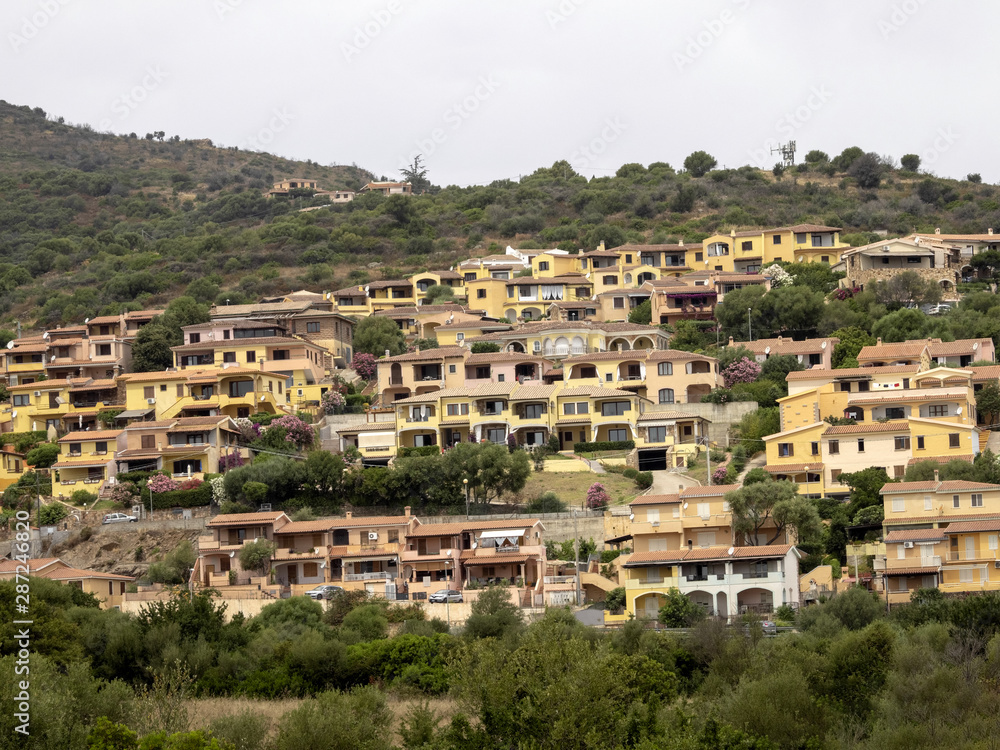 Beautiful holiday resorts on a slope above the sea of Sardinia