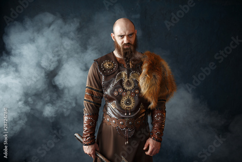 Bearded viking with axe, barbarian image