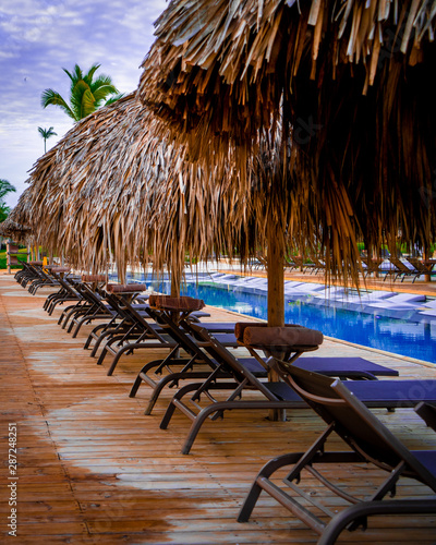 chairs and umbrella on the pool