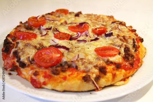 Fresh delicious pizza in closeup