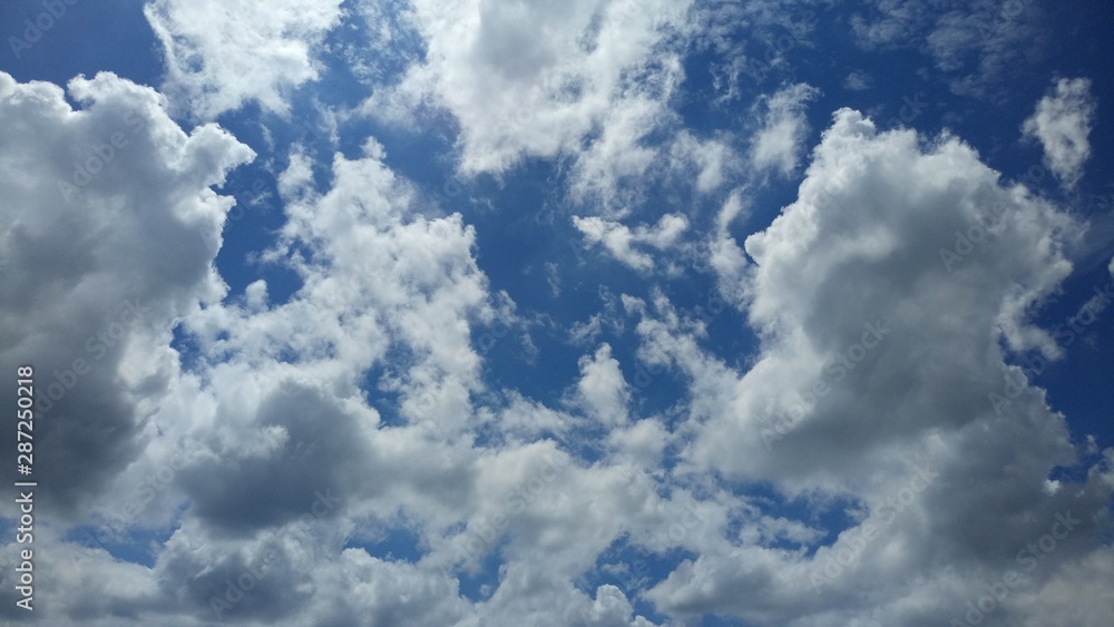 Cloud Formations On A Warm Summer Day Featuring Shades Of White, Silver, Gray and Blue Cloud Formations On A Warm Summer Day Featuring Shades Of White, Silver, Gray and Blue