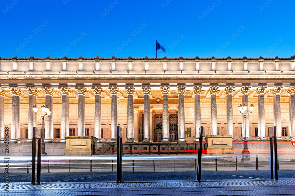 Naklejka premium Illuminated building of courthouse Cour de Appel in Lyon, France. Photo taken at blue hour in twilight
