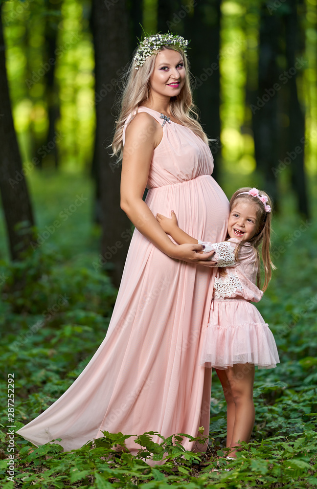 Pregnant woman and her daughter