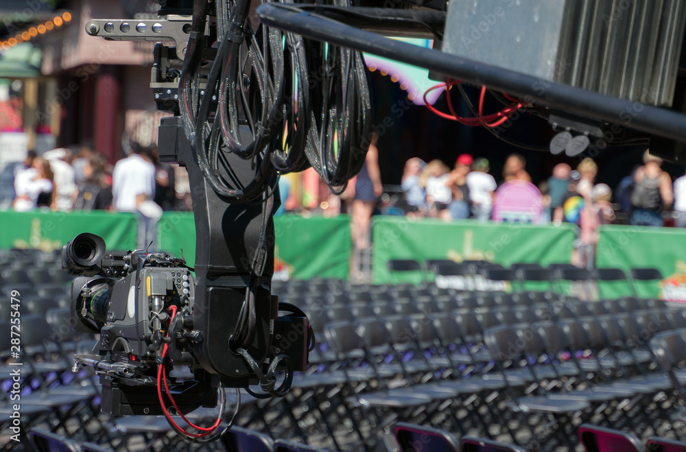 Professional video camera on automated motorized arm. Professional video camera on automated motorized arm.