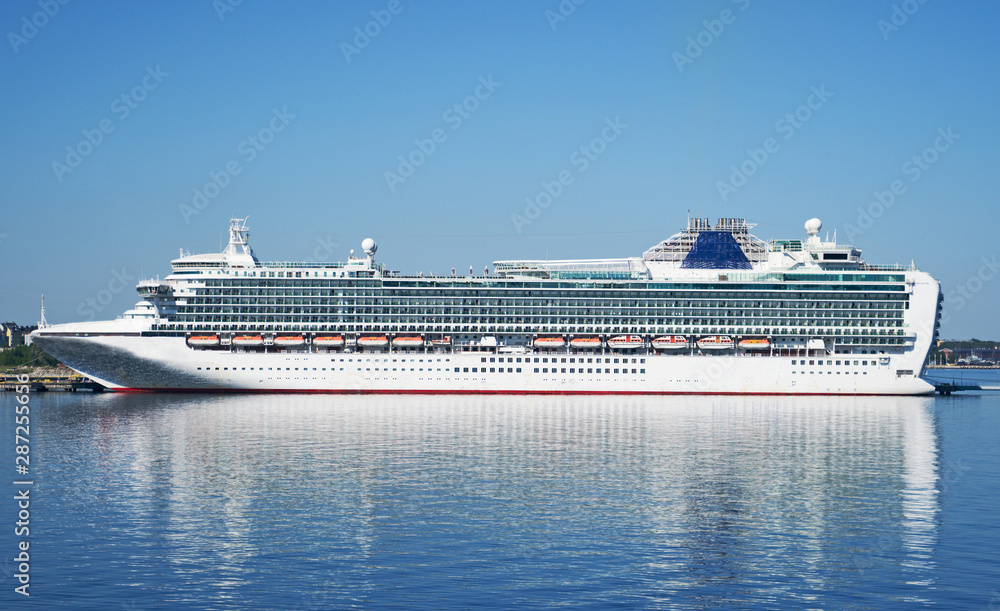 Huge white cruise ship moored in the port.