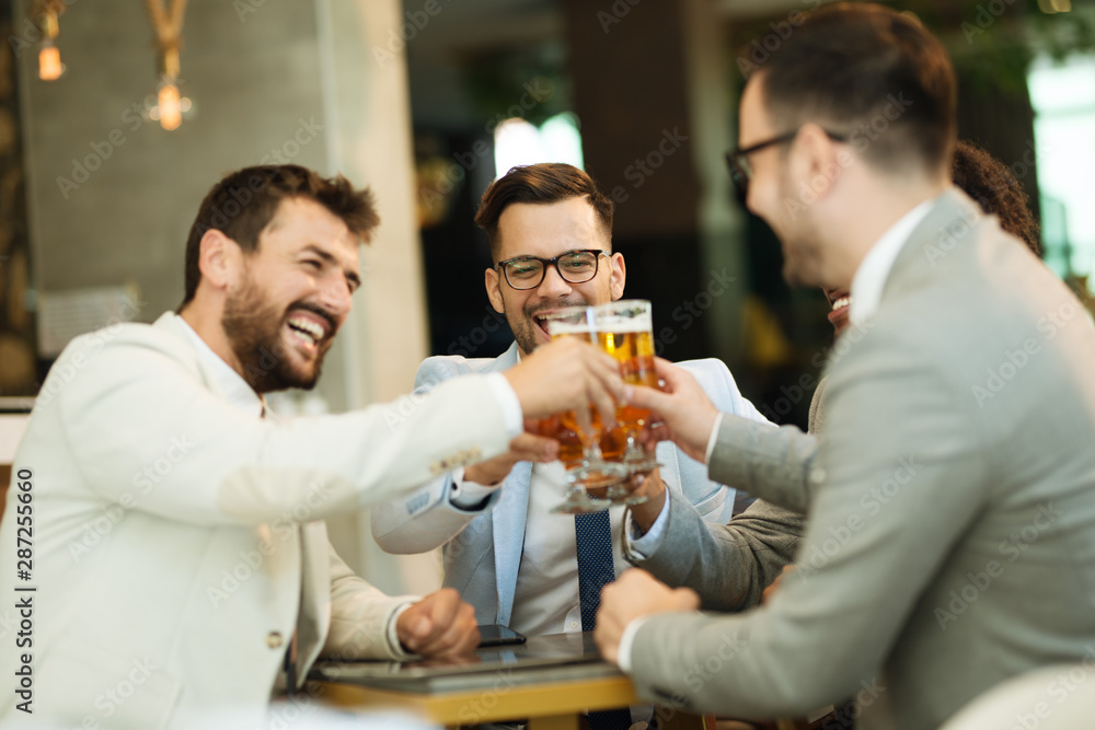 young businessmen after work in a pub