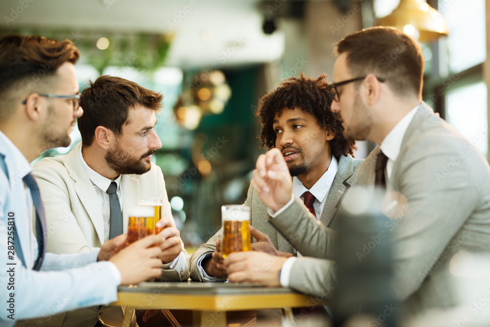 young businessmen after work in a pub