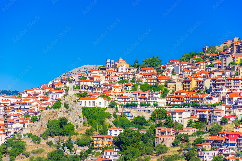 Fototapeta premium Scenic view of Arachova Village. Arachova is famous for its panoramic view, uphill small houses and the cobbled streets show a picturesque architecture at Parnassos Mountain, Greece.