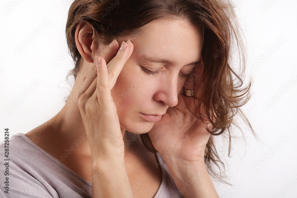 Studio shot of a young woman suffering from headache Studio shot of a young woman suffering from headache