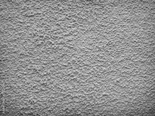 Texture of concrete wall with decorative plaster - photo. Color is gray.