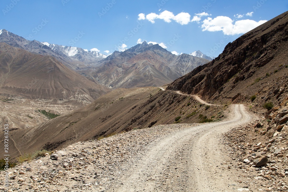 unpaved road in Tajikistan, Wakhan valley, Pamir unpaved road in Tajikistan, Wakhan valley, Pamir