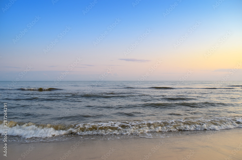 Panorama of sea waves on the background of dawn
