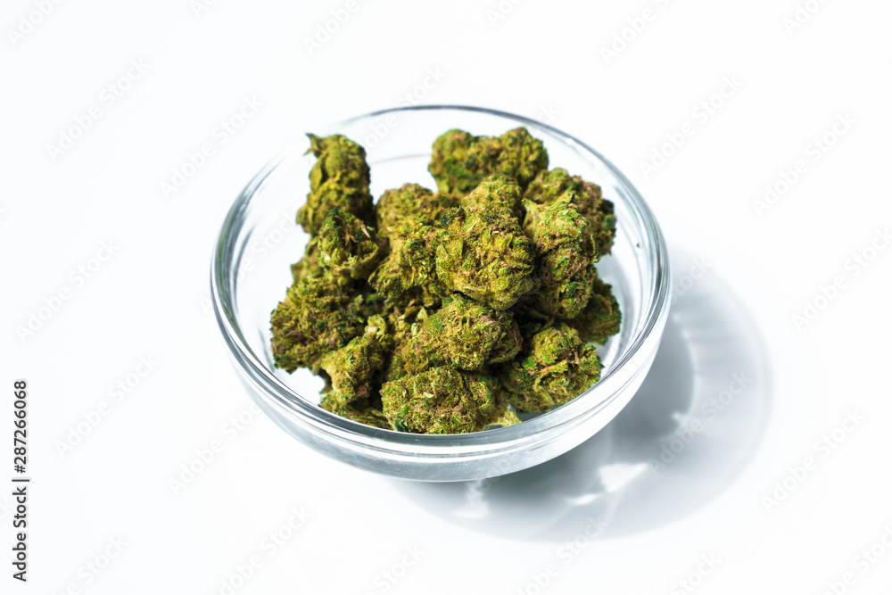 bowl full of marijuana buds bowl full of marijuana buds