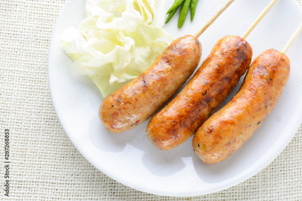 Thai Spicy Sausages, made from minced pork mixed with a variety of ingredients which makes it packed with flavour, and gives it a unique scent. Thai Spicy Sausages, made from minced pork mixed with a variety of ingredients which makes it packed with flavour, and gives it a unique scent.