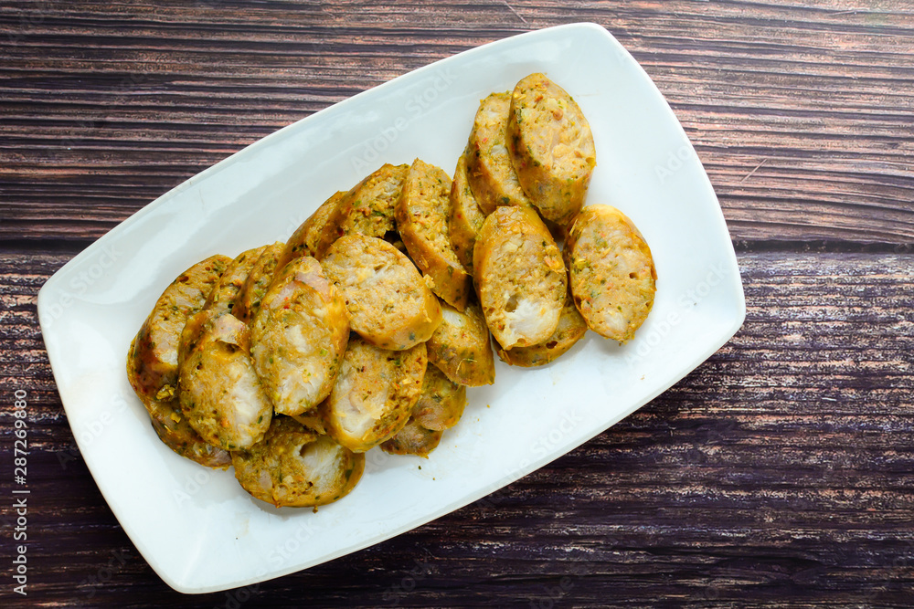 Thai Spicy Sausages, made from minced pork mixed with a variety of ingredients which makes it packed with flavour, and gives it a unique scent. Thai Spicy Sausages, made from minced pork mixed with a variety of ingredients which makes it packed with flavour, and gives it a unique scent.