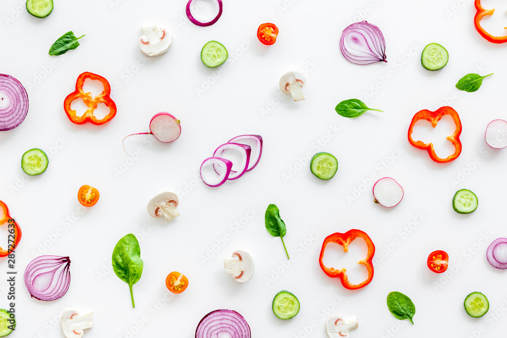 Layout of colorful vegetables on white background top view pattern Layout of colorful vegetables on white background top view pattern