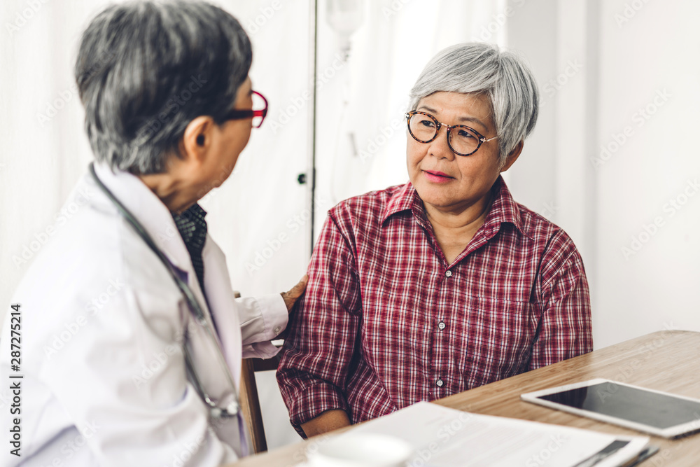 Fototapeta premium Doctor consulting and check up information with senior woman in hospital.elderly woman has sick.healthcare and medicine
