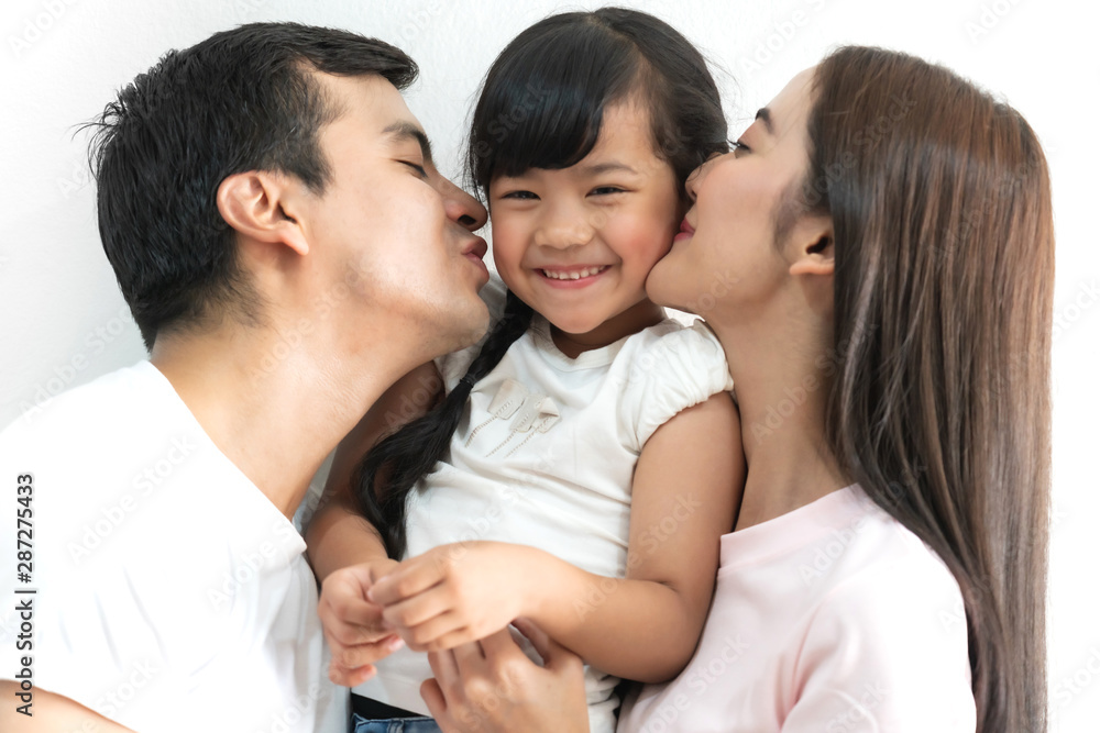 Portrait of happy family father and mother with daughter on white background Portrait of happy family father and mother with daughter on white background