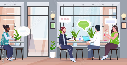 people using gadgets chat bubble social media online communication concept mix race visitors drinking coffee having fun modern cafe interior flat full length horizontal