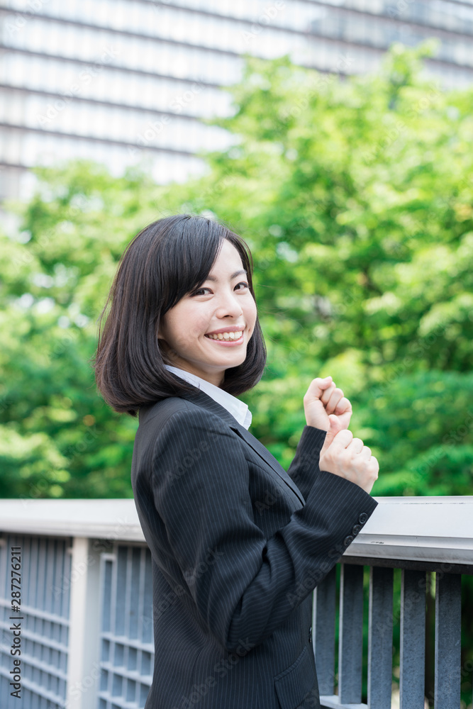 Happy young business woman outdoors