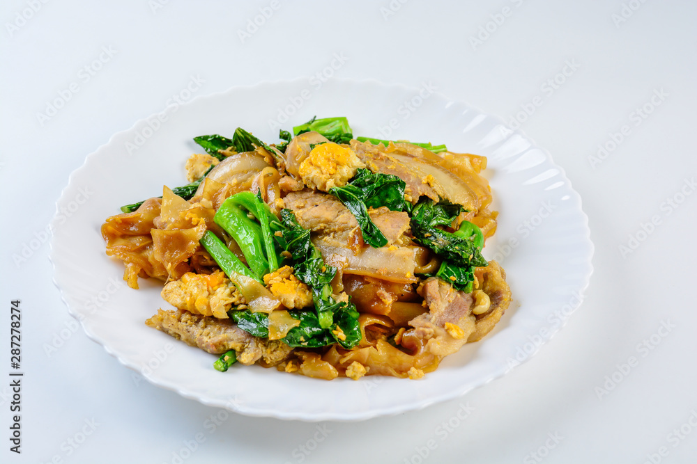 Stir-fried Fresh Rice-flour Noodles With Sliced Pork, Egg and Kale. Quick noodle stir-fry.