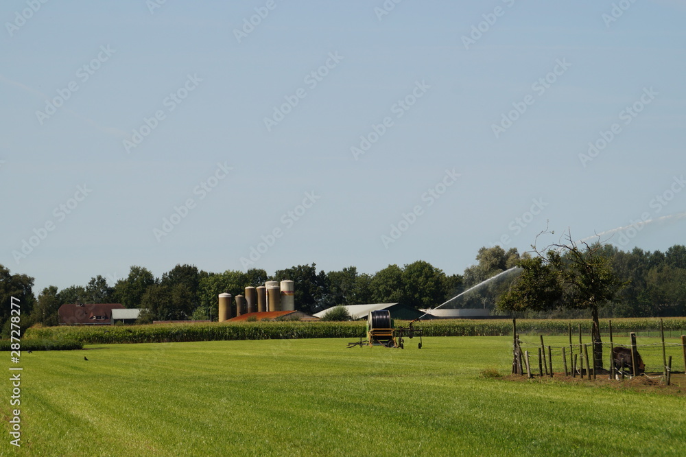 rural landscape with agriculture equipment