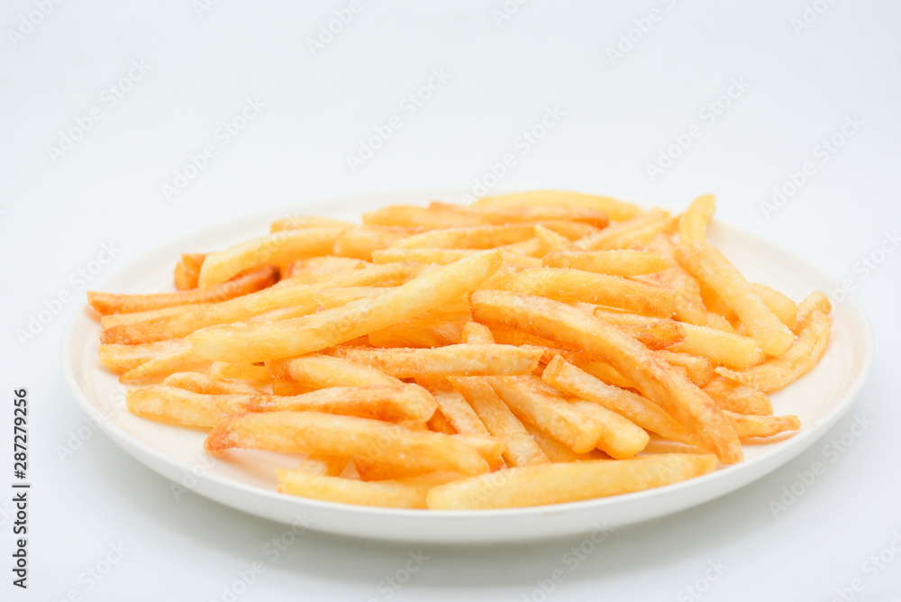French fries on white dish and white background.