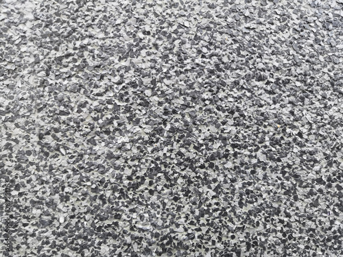 Color flake flooring textured background .Close up.Color Flakes make resinous flooring as beautiful as it is practical.Concrete floor,sprinkle with flake stone and smooth.