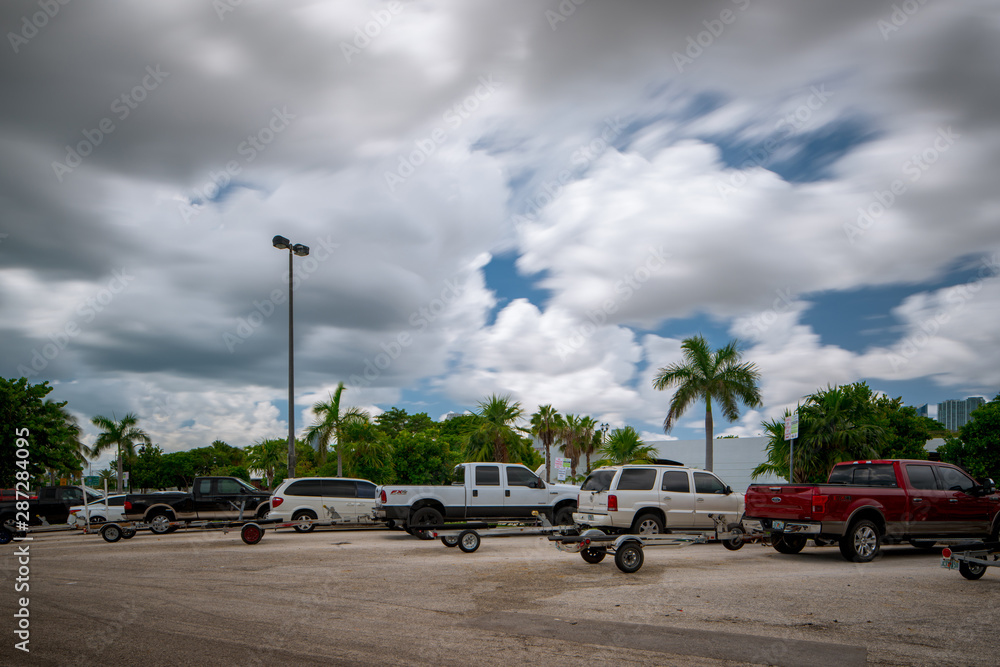 Trucks with trailers at a marina in Miami FL
