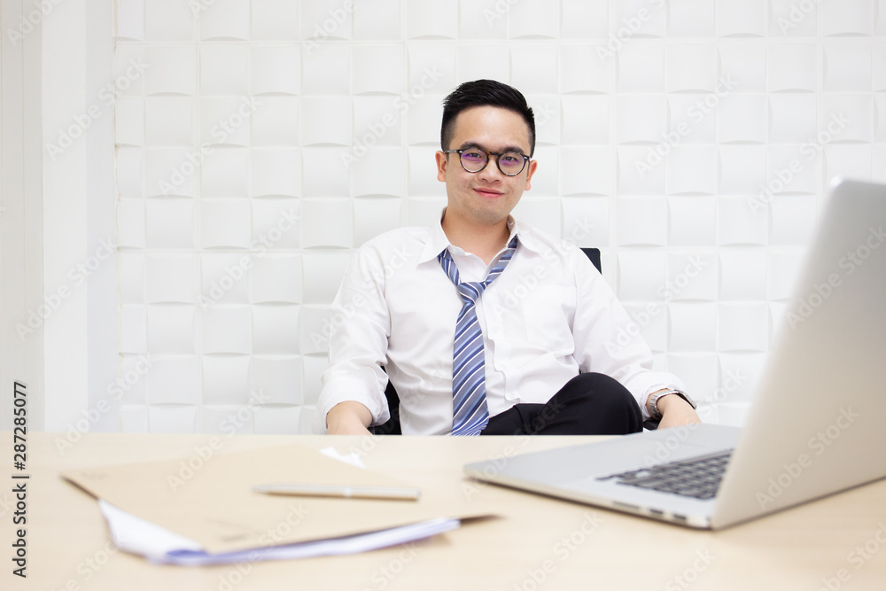 Fototapeta premium Asian businessman's portrait. Workaholic and hard working people concept.