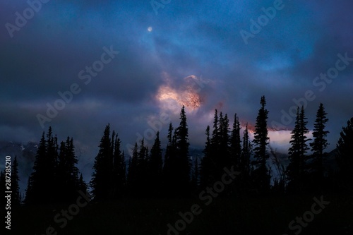 Sunrise glow and clouds Mt Rainier