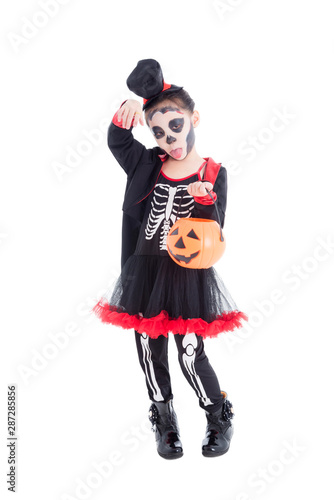 Full length of asian girl in skeleton costume holding halloween pumpkin bucket,standing over white background