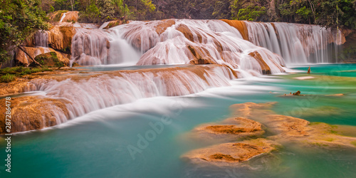 Panoramic photograph and long exposure of the Agua Azul cascades and waterfalls in the tropical rainforest of Chiapas state near the city of Palenque, Mexico. photo