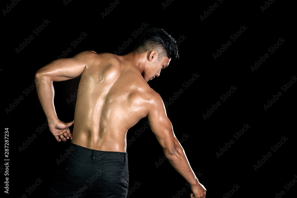Asian muscle men posing muscle front on the black background | Body gym big shoulder and back