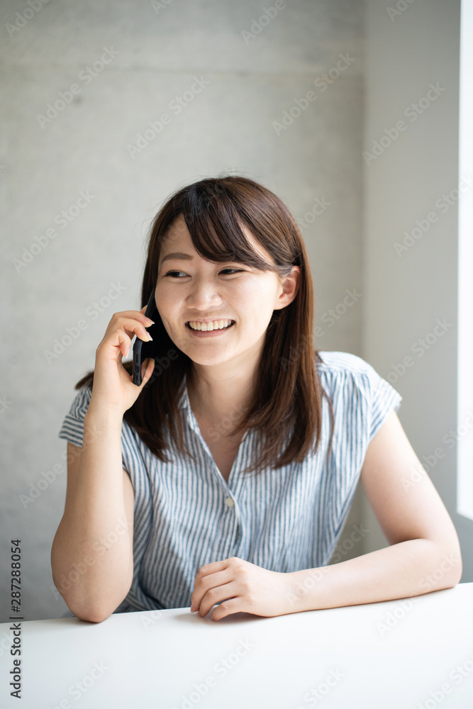 Young woman talkin on smart phone Young woman talkin on smart phone