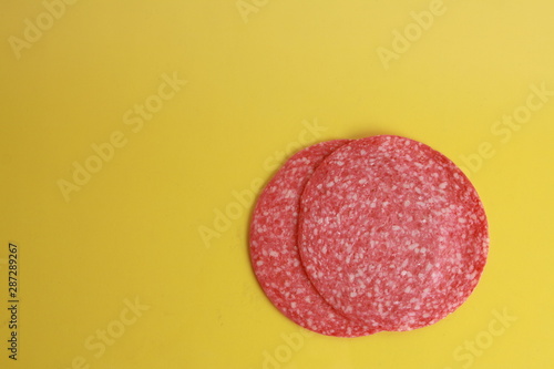 slices of salami in colorful background