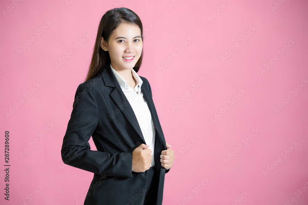 Beautiful asian business woman isolated on pink background Beautiful asian business woman isolated on pink background