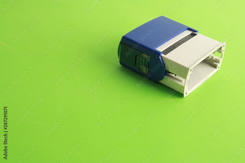 Fototapeta premium Automatic ink stamp manufactured in blue plastic