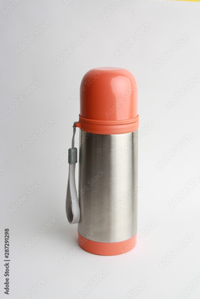 orange thermos to keep the drink hot orange thermos to keep the drink hot