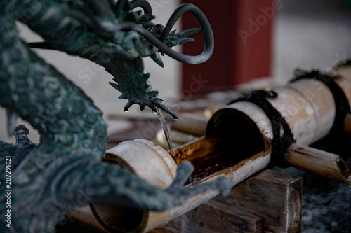 Purification trough at Ikegami honmonji temple in Tokyo photo