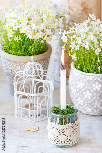 Simple glass jar transformed into a beautiful candle holder decorated with lace and moss. photo