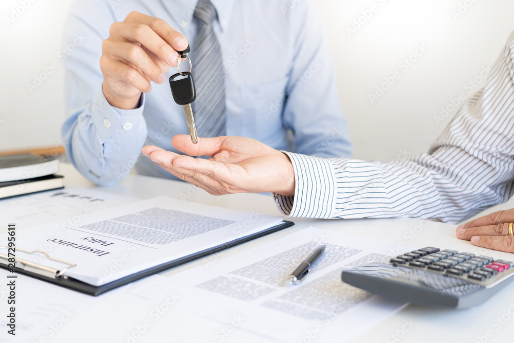 business man agent offer insurance form clipped to pad and silver pen to sign closeup. Certificate of motor insurance and policy schedule with car key, consultant signing car contract business man agent offer insurance form clipped to pad and silver pen to sign closeup. Certificate of motor insurance and policy schedule with car key, consultant signing car contract