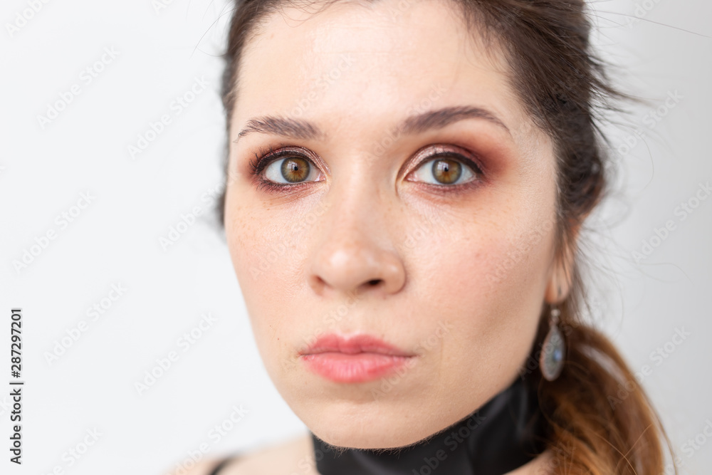Gothic, make-up, fashion and people concept - Young stylish beautiful woman with white skin and red lips on white background Gothic, make-up, fashion and people concept - Young stylish beautiful woman with white skin and red lips on white background