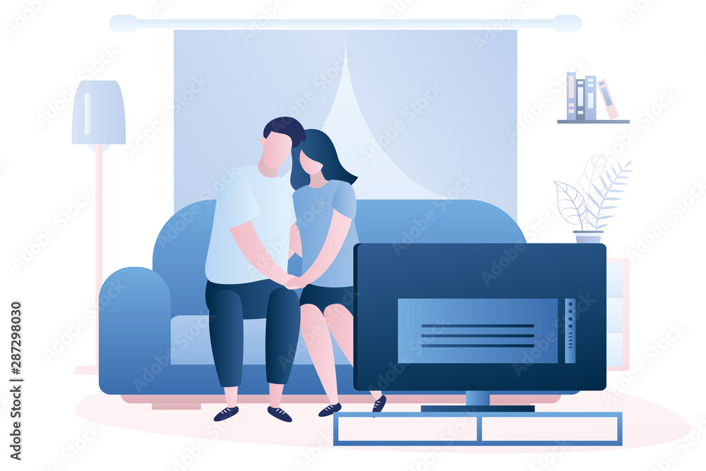 Fototapeta premium Love couple is sitting on the couch and watch tv, living room interior with furniture.